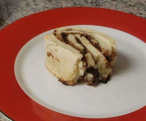 Freshly baked cinnamon rolls with vanilla icing drizzled on top